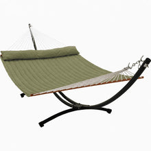 Load image into Gallery viewer, Olive king quilted hammock with matching pillow and wooden spreader bars on a black 12ft steel arc stand.