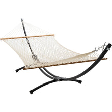 Load image into Gallery viewer, Cream polyester rope hammock with wooden spreader bars on a black 12ft steel arc stand