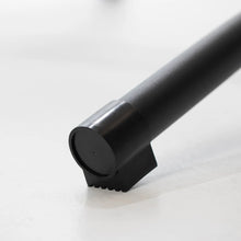 Load image into Gallery viewer, Close-up of the protective black end cap on a hammock stand foot