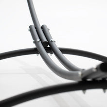 Load image into Gallery viewer, Close-up of the twin curved steel rails and crosswise support feet on the hammock stand