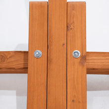 Load image into Gallery viewer, Close-up of the larch wood hammock stand’s bolted frame connection above a crosswise support foot