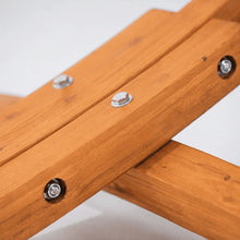 Load image into Gallery viewer, Close-up of the bolts securing the curved timber frame to the hammock stand’s support foot