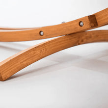 Load image into Gallery viewer, Close-up of the curved support foot beneath the larch wood arc hammock stand
