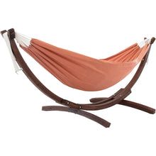 Load image into Gallery viewer, Coral double Sunbrella® hammock on a curved solid pine stand against a white background.