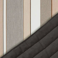 Load image into Gallery viewer, Close-up of Dove grey, beige and white striped fabric with the dark padded quilted underside folded back.