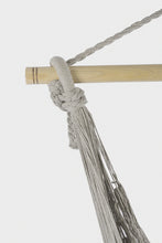 Load image into Gallery viewer, Close-up of grey suspension ropes knotted around the hammock swing chair's wooden spreader bar