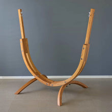 Load image into Gallery viewer, Front view of the Coastal Lounger timber hammock chair stand on a tiled floor